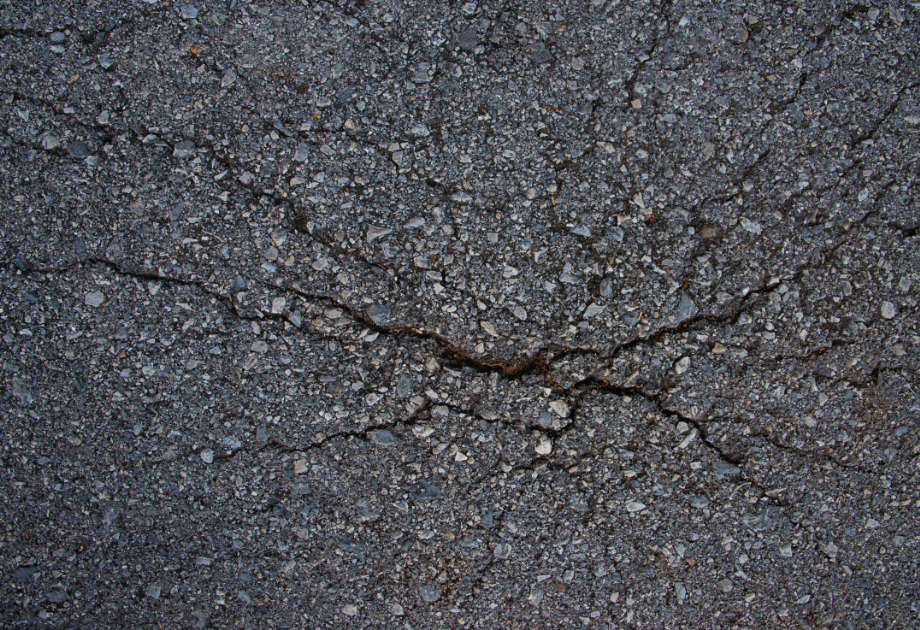 closeup of cracks in asphalt